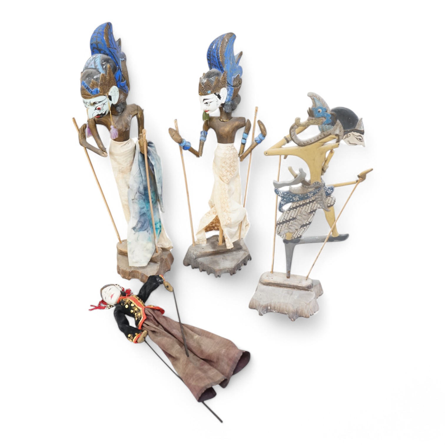 Three Thai carved wooden puppets and similar wooden puppet. Tallest 65cm high. Condition - fair